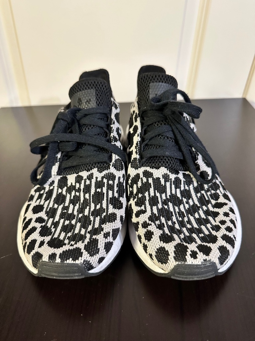 adidas Swift Run Women's sneakers in a black and white leopard print.